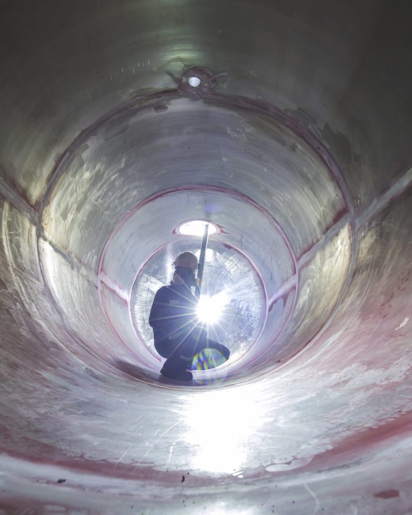 working-male-inspection-weld-underground-tank-equipment-tunnel-by-using-flashlight-side-confined-scaled.jpg
